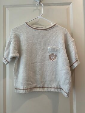 Covers women’s Cream Short-Sleeve Knit Boxy Sweater w/ Tan Trim short sleeves M